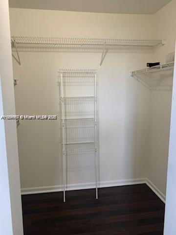 2071 Renaissance Boulevard, Unit 108 Miramar, FL 33025 - Photo 16 of 25 a view of walk in closet with empty racks