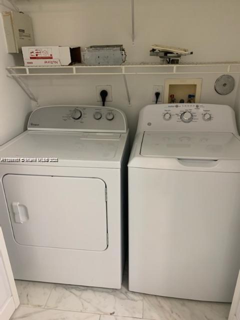 2071 Renaissance Boulevard, Unit 108 Miramar, FL 33025 - Photo 19 of 25 a utility room with dryer and washer