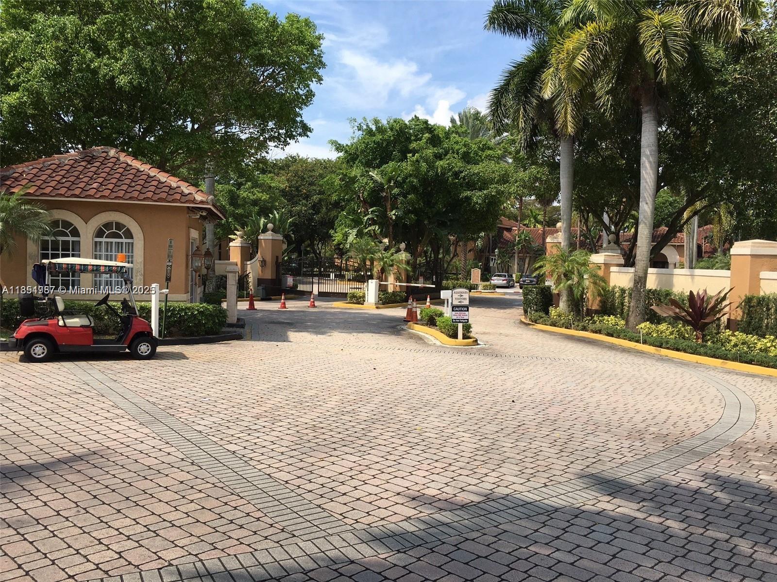 2071 Renaissance Boulevard, Unit 108 Miramar, FL 33025 - Photo 2 of 25 a view of car parked on the side of the road