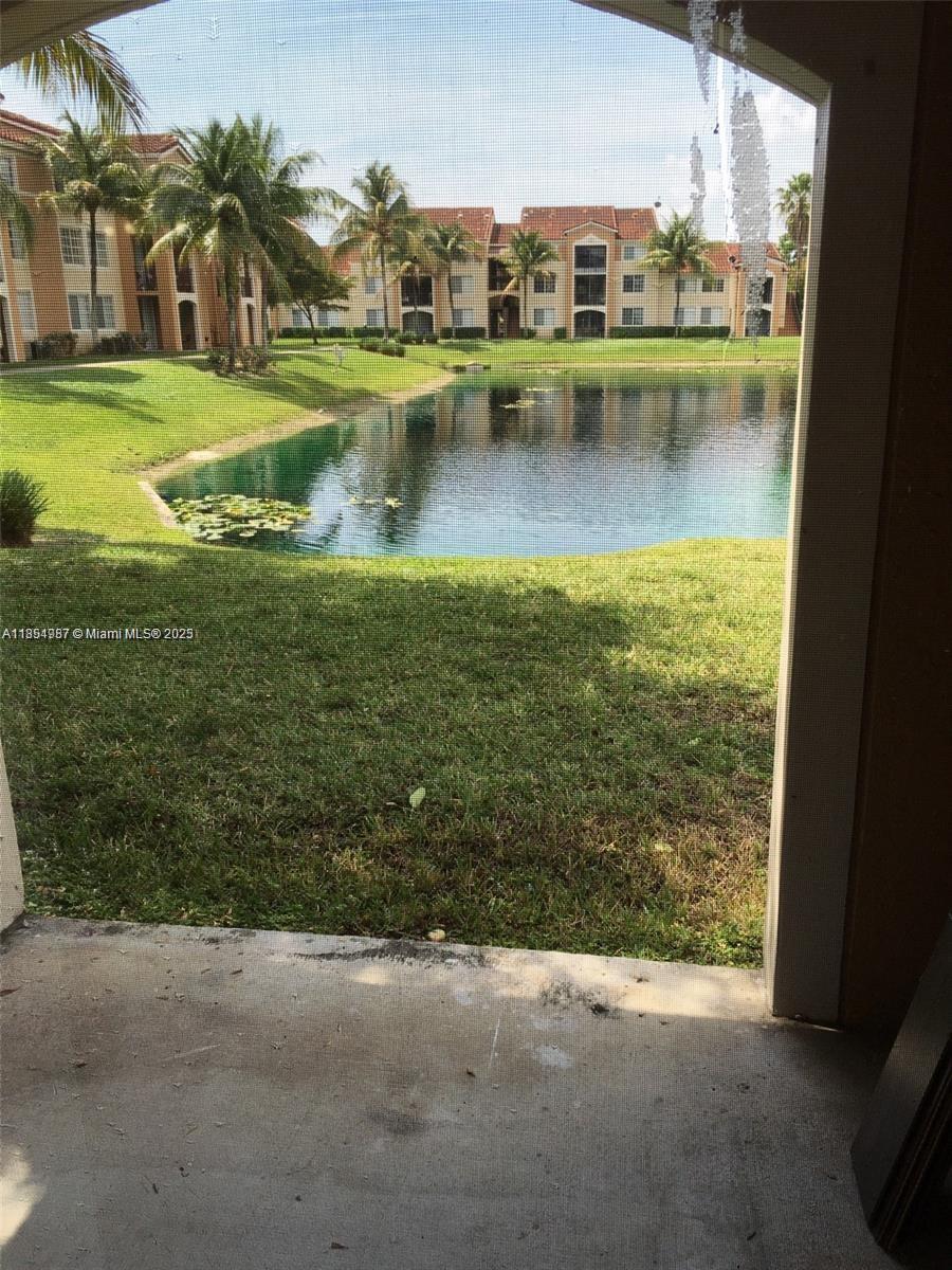 2071 Renaissance Boulevard, Unit 108 Miramar, FL 33025 - Photo 21 of 25 a view of a lake with a house