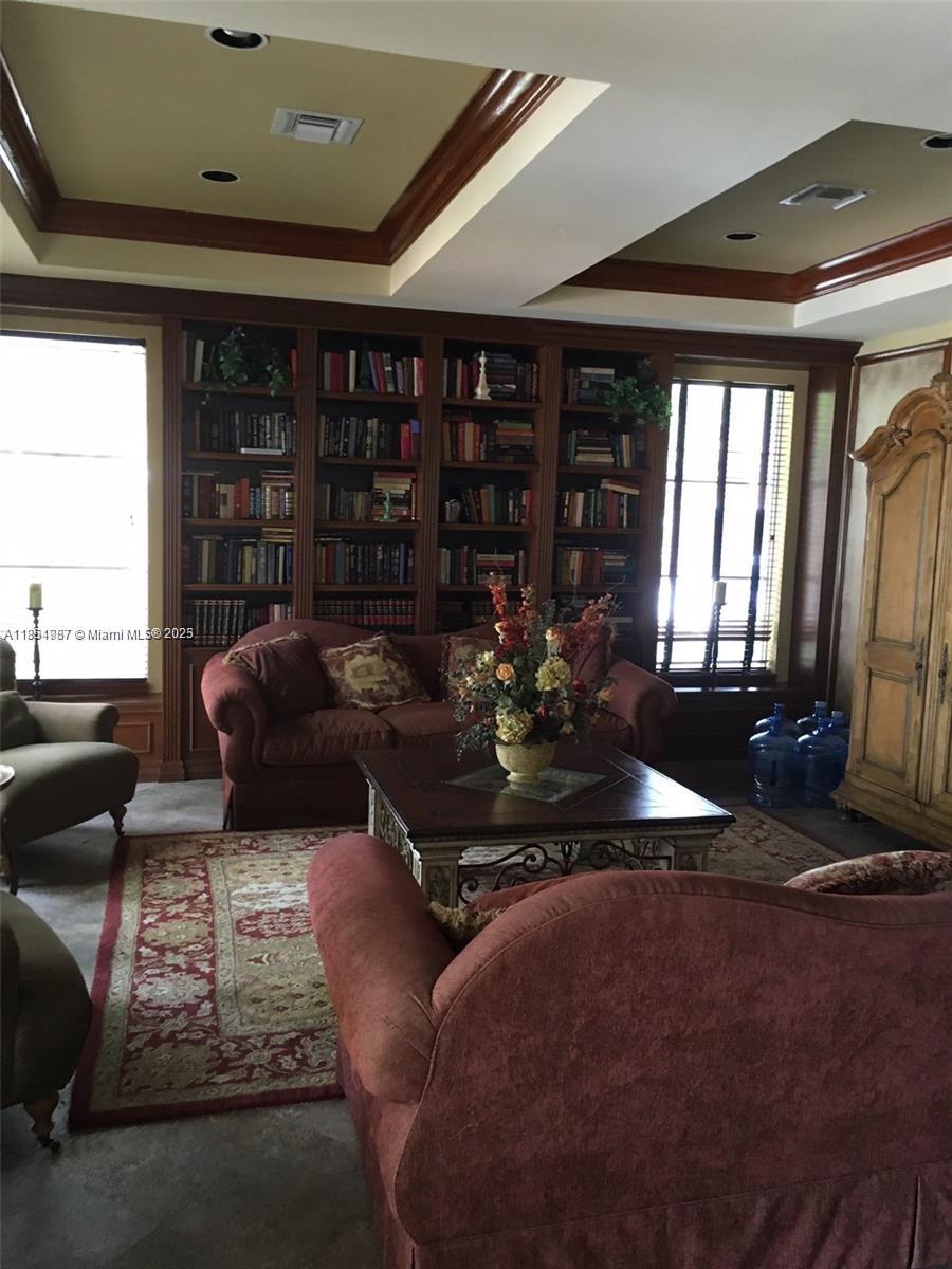 2071 Renaissance Boulevard, Unit 108 Miramar, FL 33025 - Photo 24 of 25 a living room with furniture fireplace and window