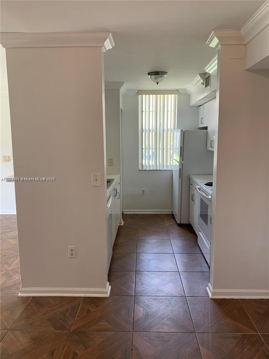 2071 Renaissance Boulevard, Unit 108 Miramar, FL 33025 - Photo 10 of 25 a view of an empty room with a window