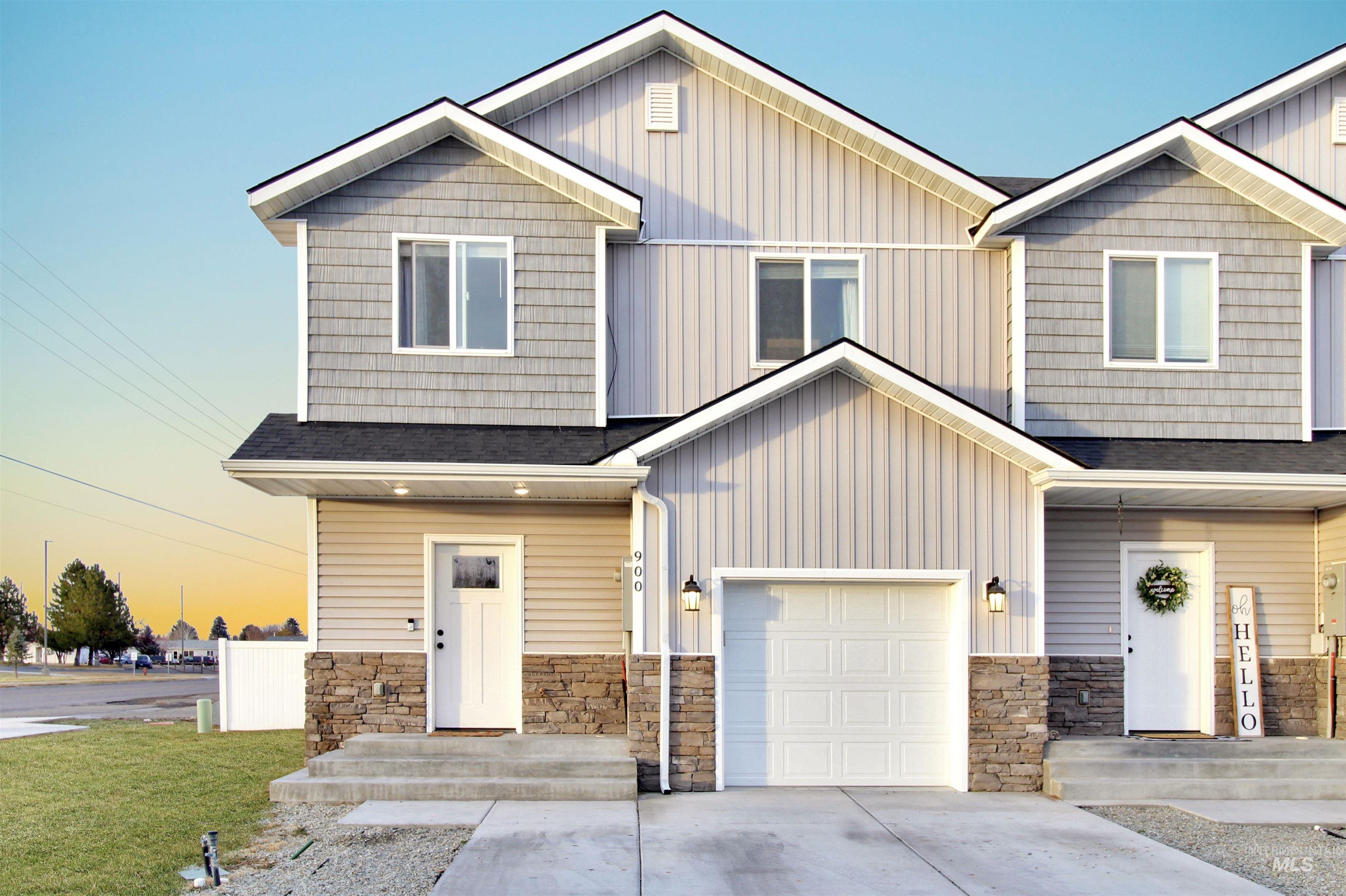 Craftsman inspired home with driveway, stone siding, a garage, and a shingled roof
