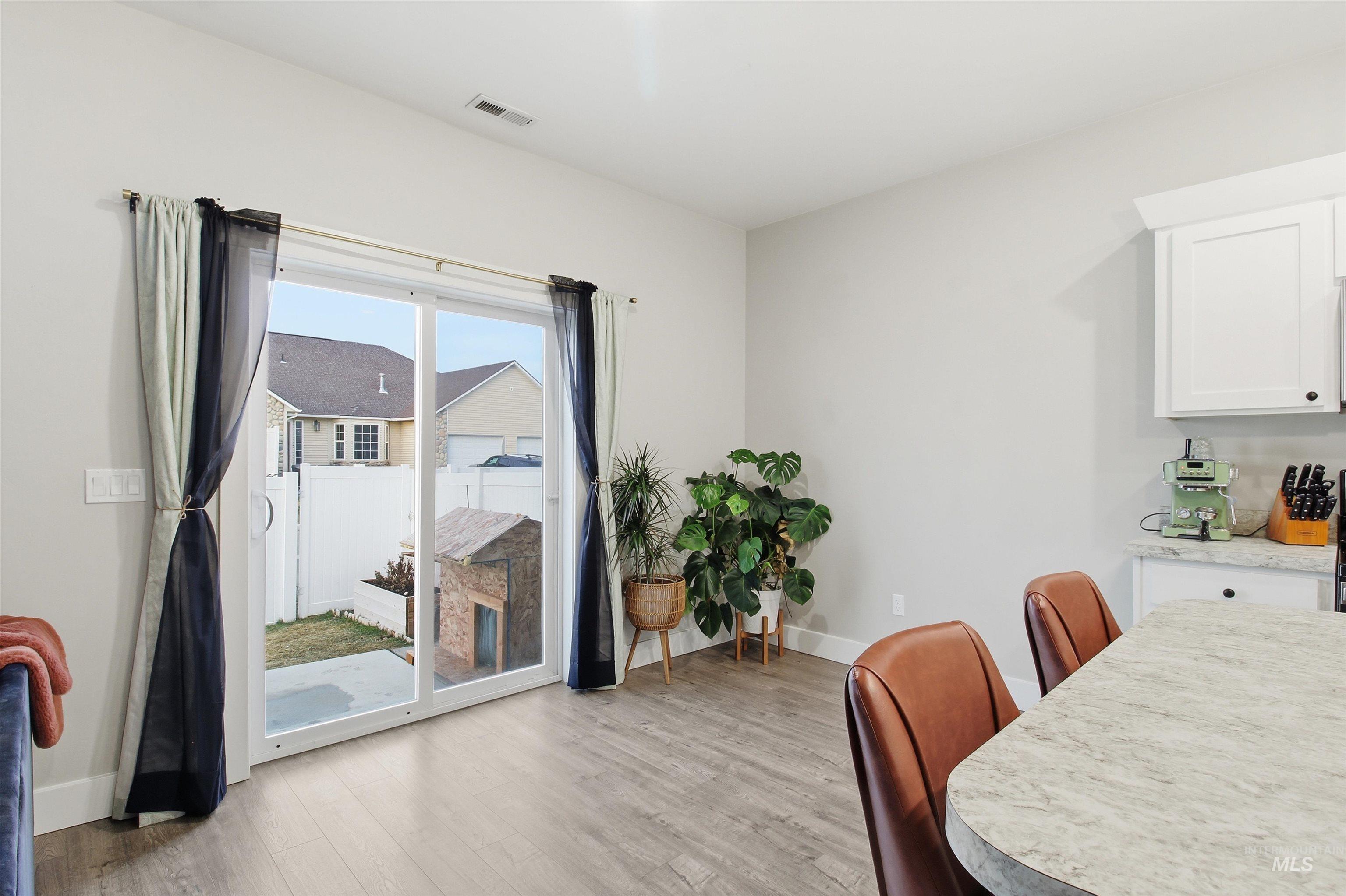 900 East 20th Street Burley, ID 83318 - Photo 15 of 31 Dining space with baseboards and light wood-style flooring