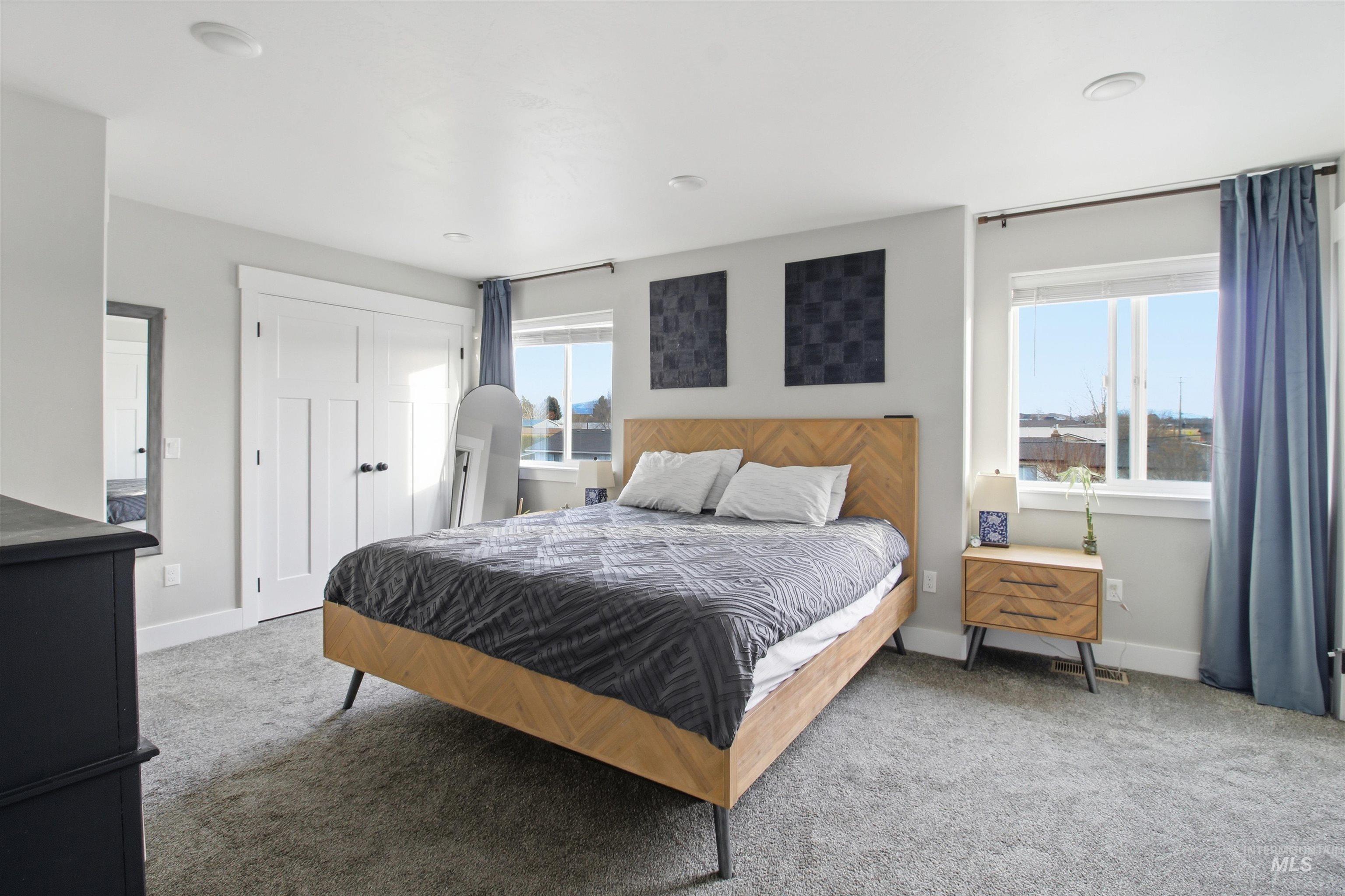 900 East 20th Street Burley, ID 83318 - Photo 18 of 31 Carpeted bedroom featuring a closet and baseboards