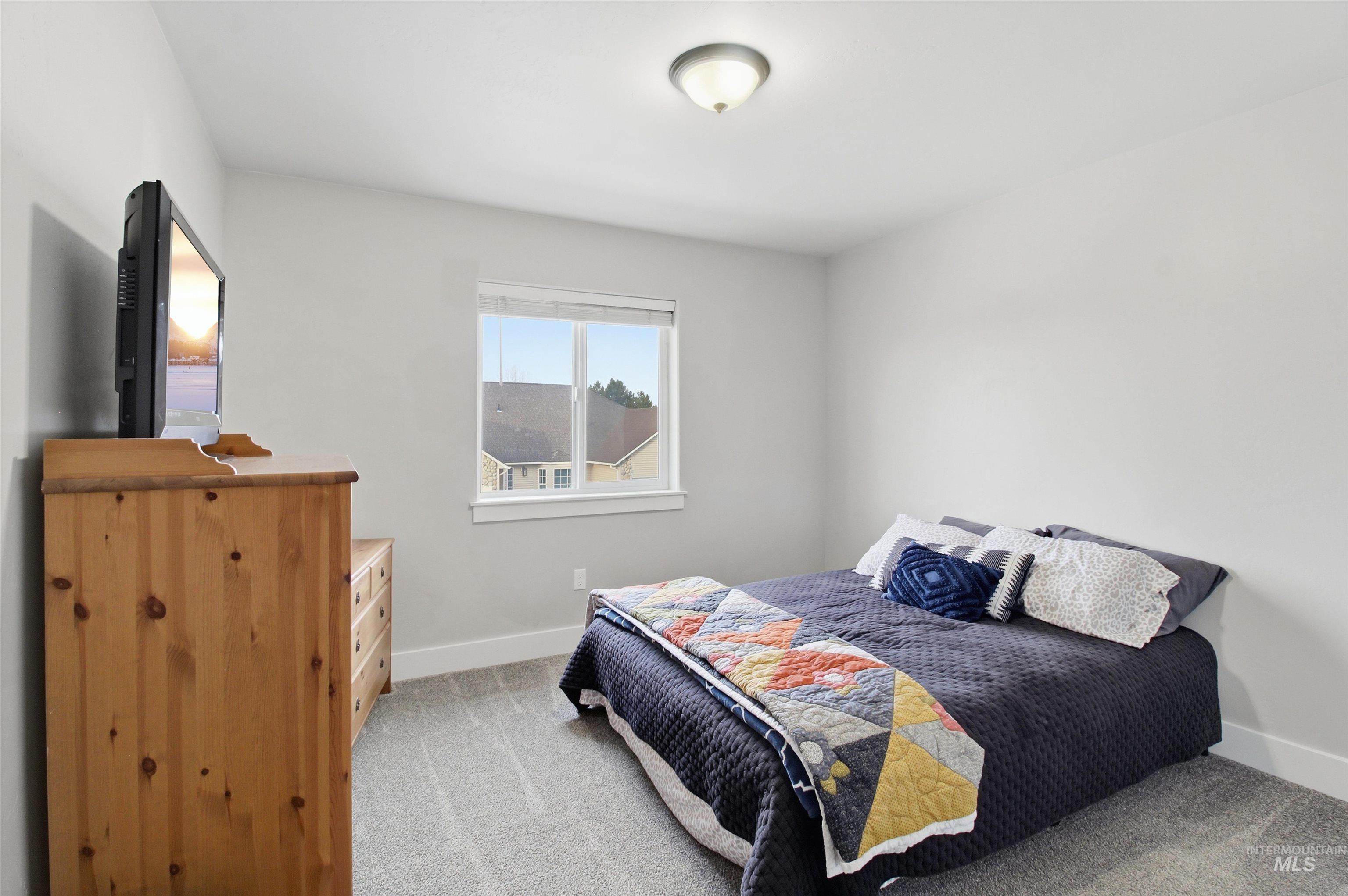 900 East 20th Street Burley, ID 83318 - Photo 21 of 31 Bedroom featuring baseboards and light colored carpet