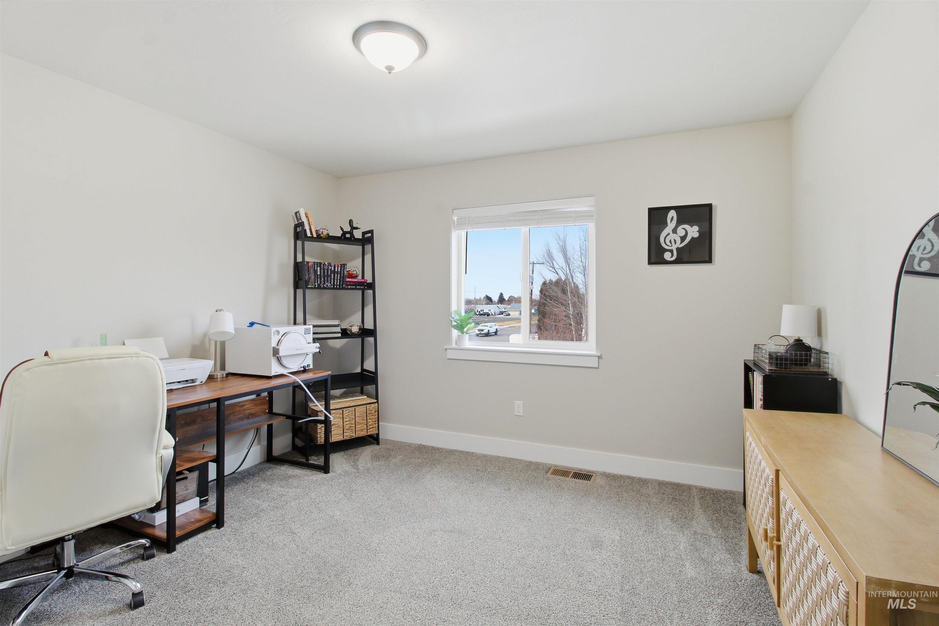 900 East 20th Street Burley, ID 83318 - Photo 24 of 31 Home office featuring light colored carpet and baseboards
