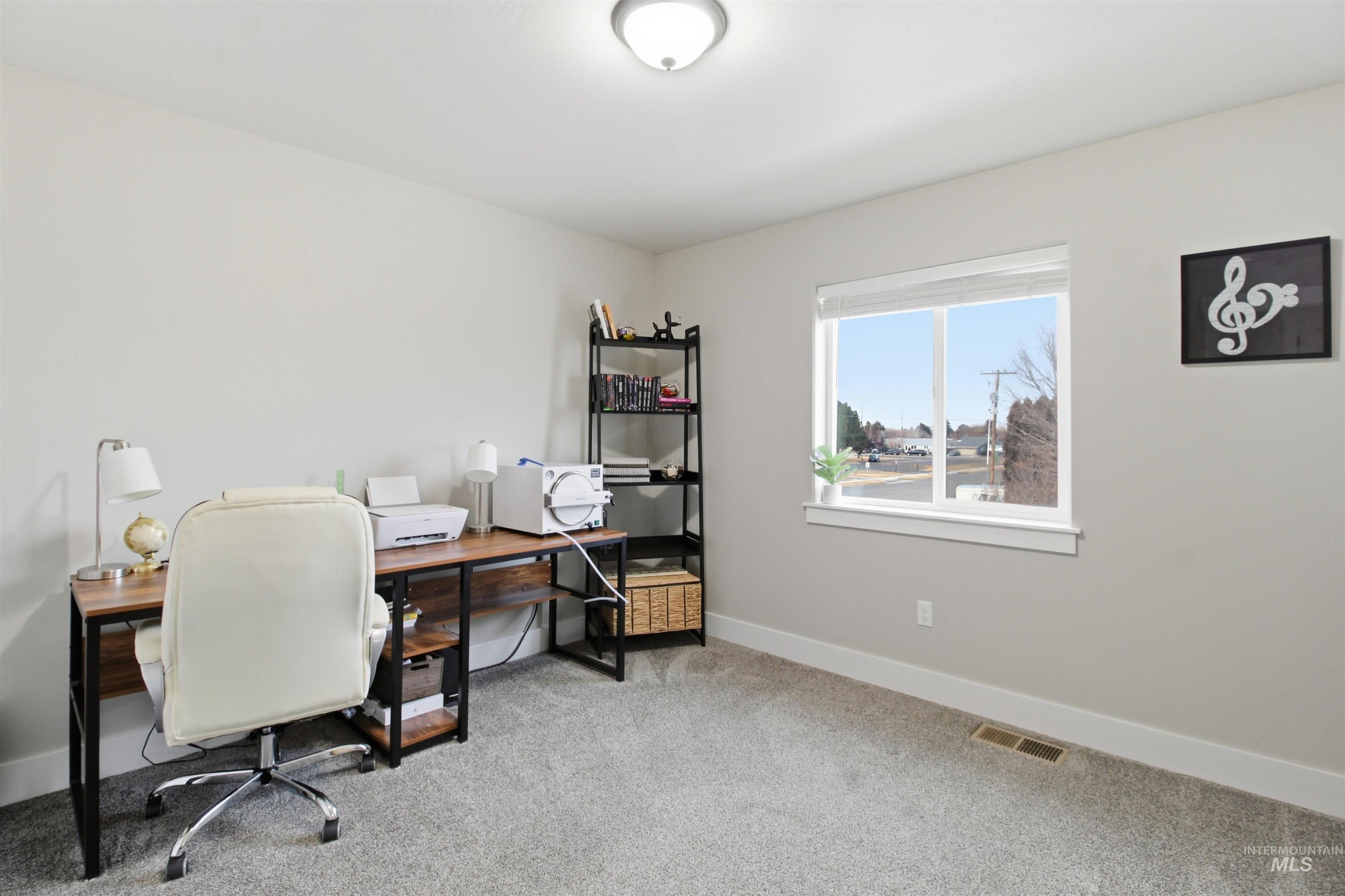 900 East 20th Street Burley, ID 83318 - Photo 25 of 31 Office area with light carpet and baseboards