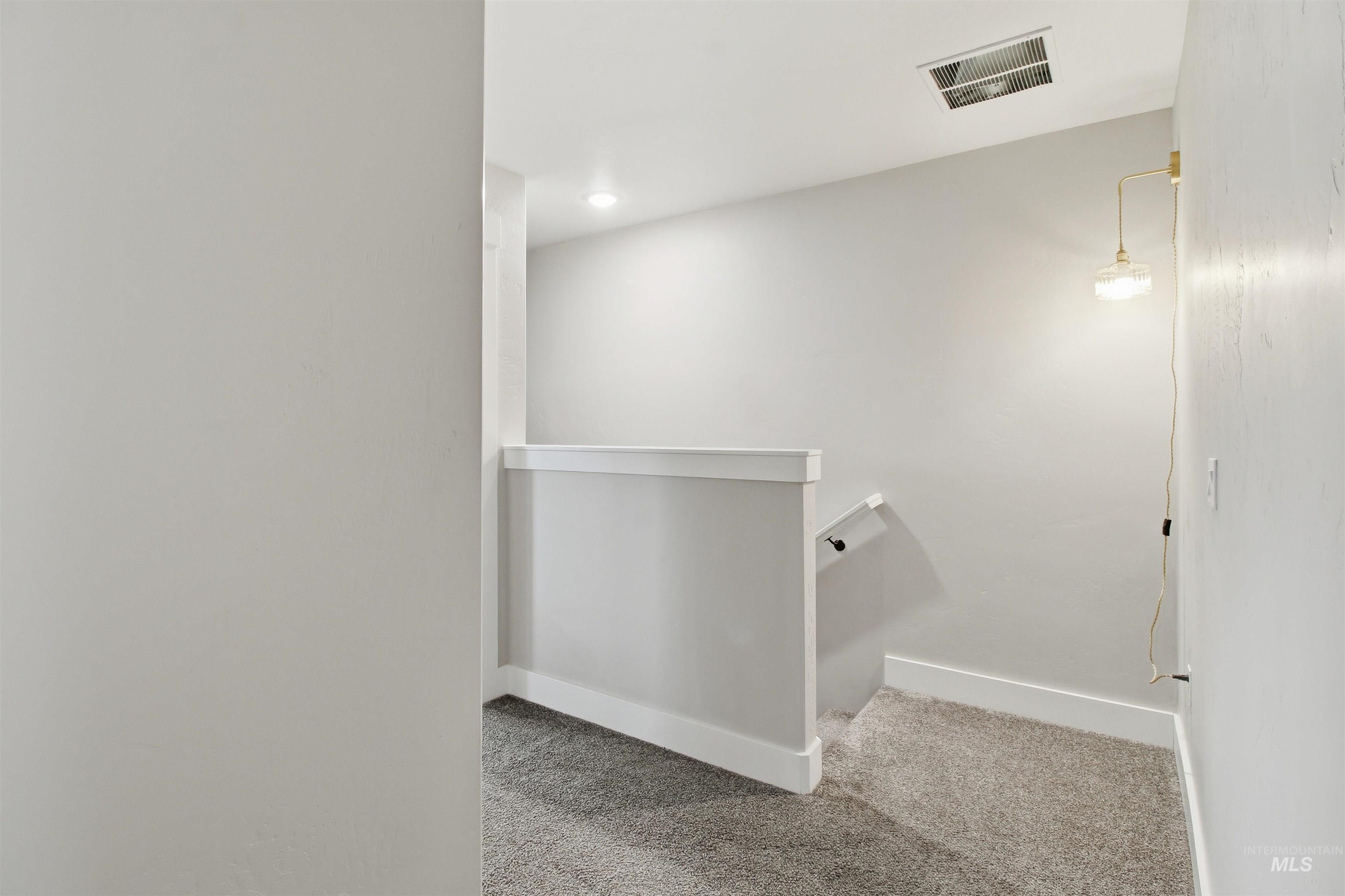 900 East 20th Street Burley, ID 83318 - Photo 27 of 31 Stairway with carpet flooring and recessed lighting