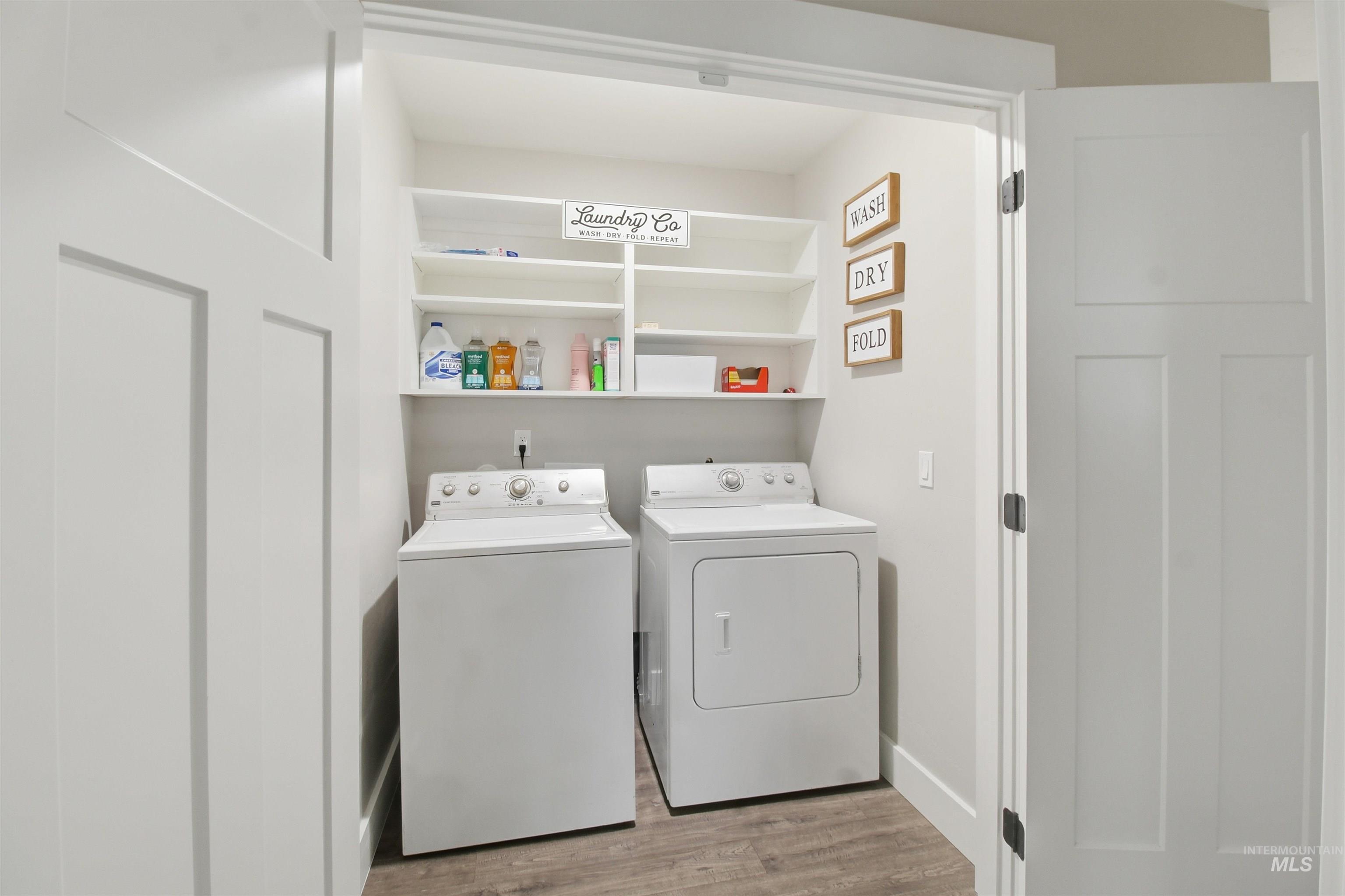 900 East 20th Street Burley, ID 83318 - Photo 28 of 31 Laundry area with light wood finished floors and washer and clothes dryer