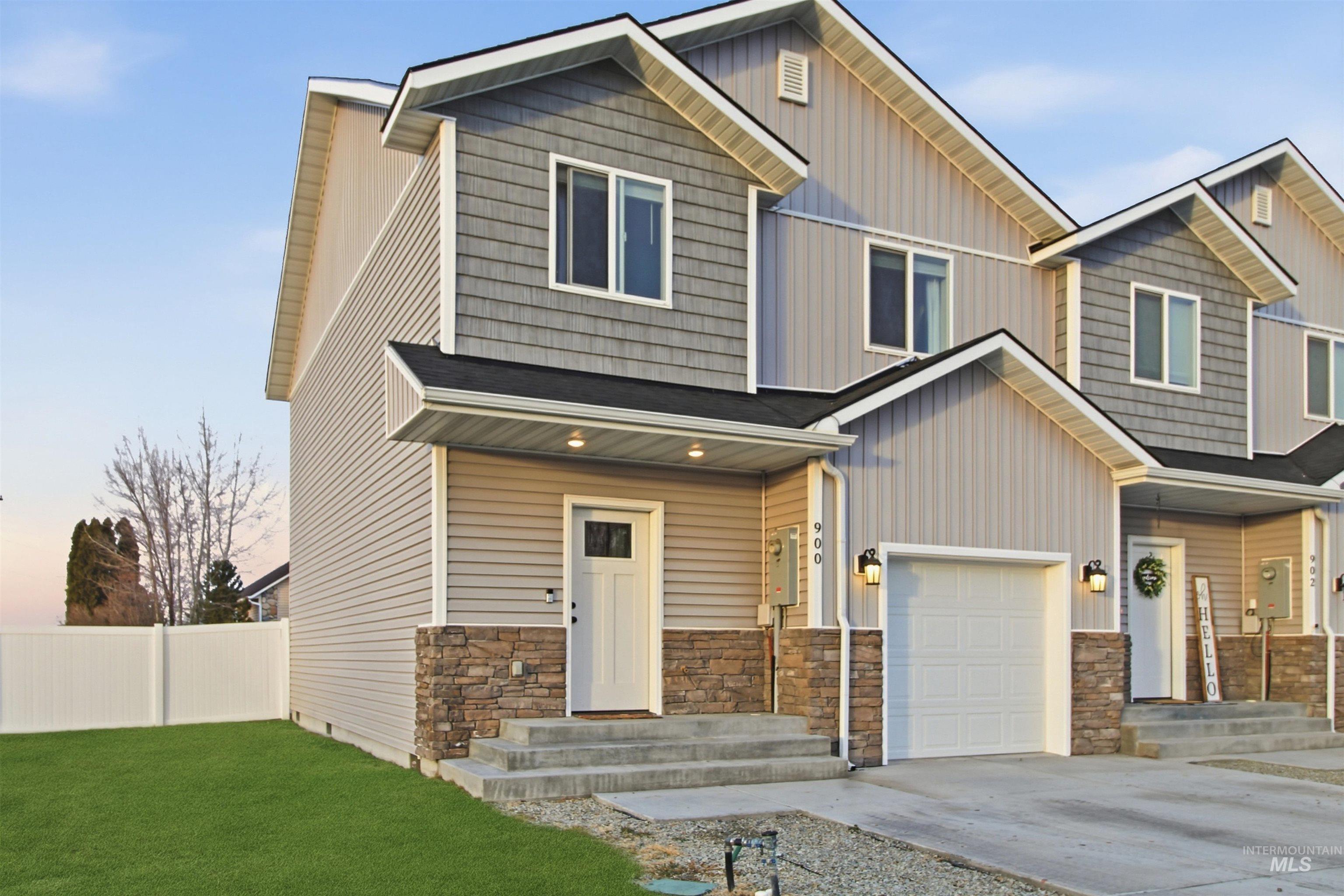 900 East 20th Street Burley, ID 83318 - Photo 30 of 31 Craftsman inspired home with stone siding, driveway, board and batten siding, and an attached garage