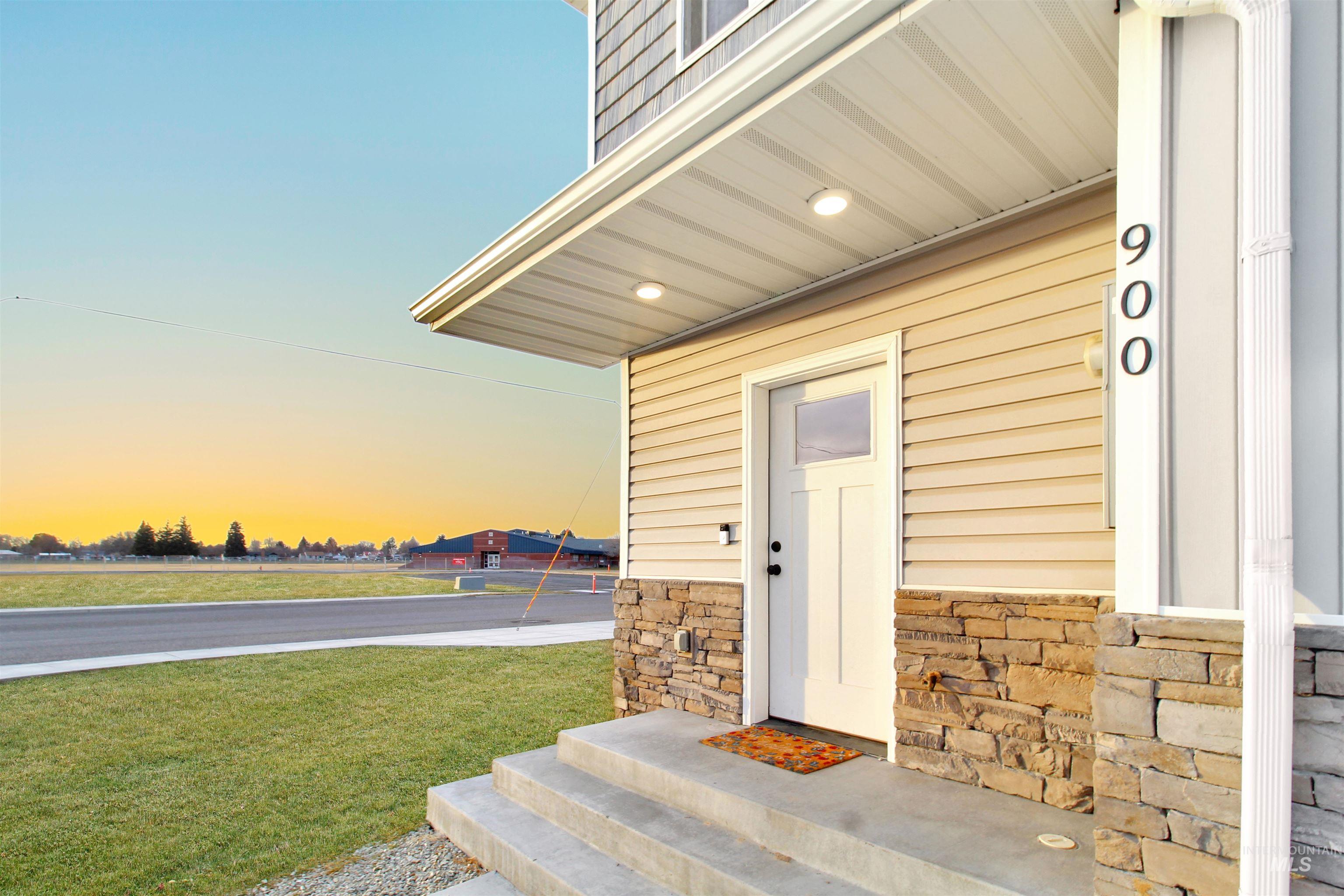 900 East 20th Street Burley, ID 83318 - Photo 3 of 31 Entrance to property with stone siding and a lawn