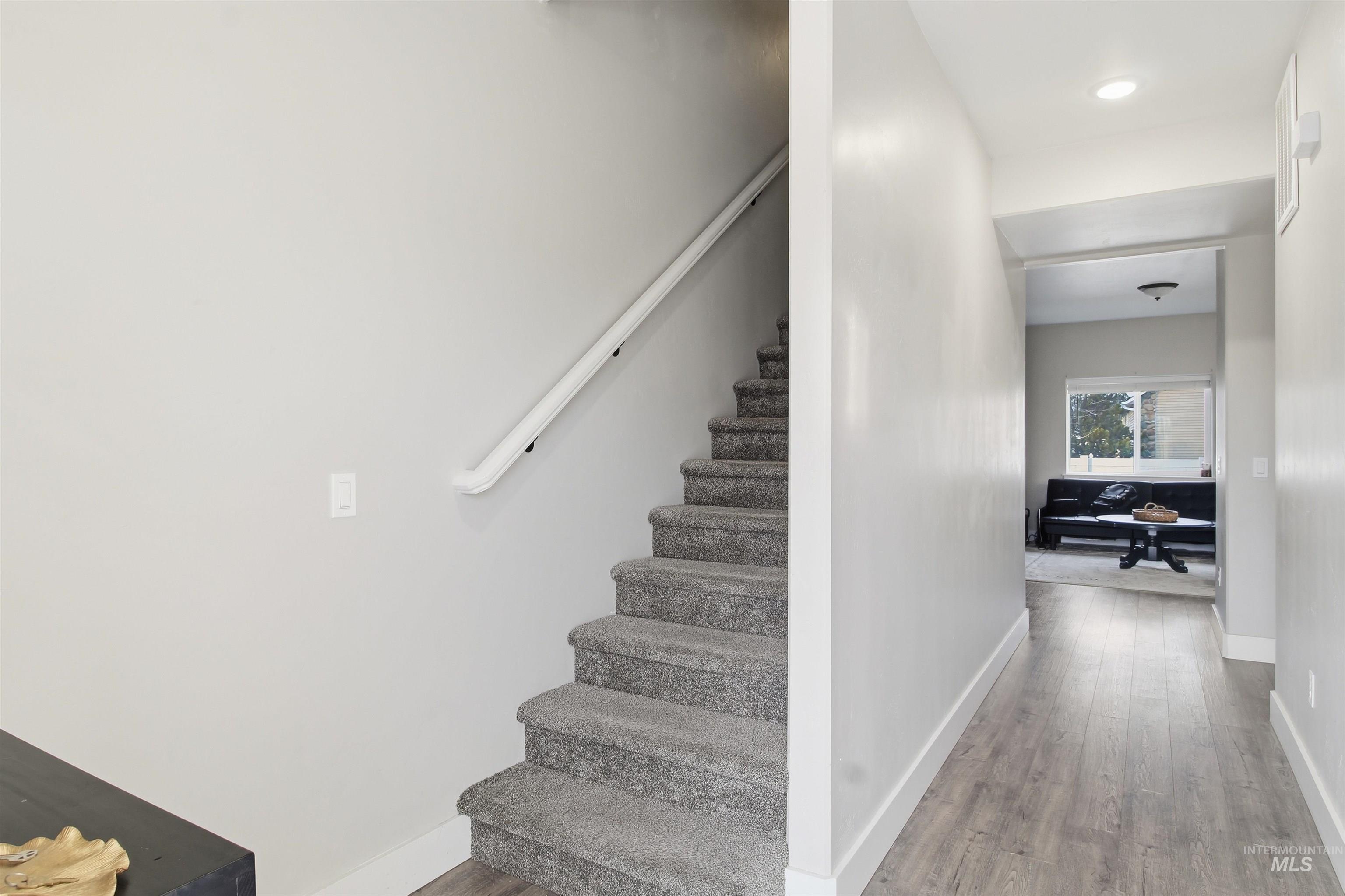 900 East 20th Street Burley, ID 83318 - Photo 5 of 31 Stairway featuring wood finished floors and recessed lighting