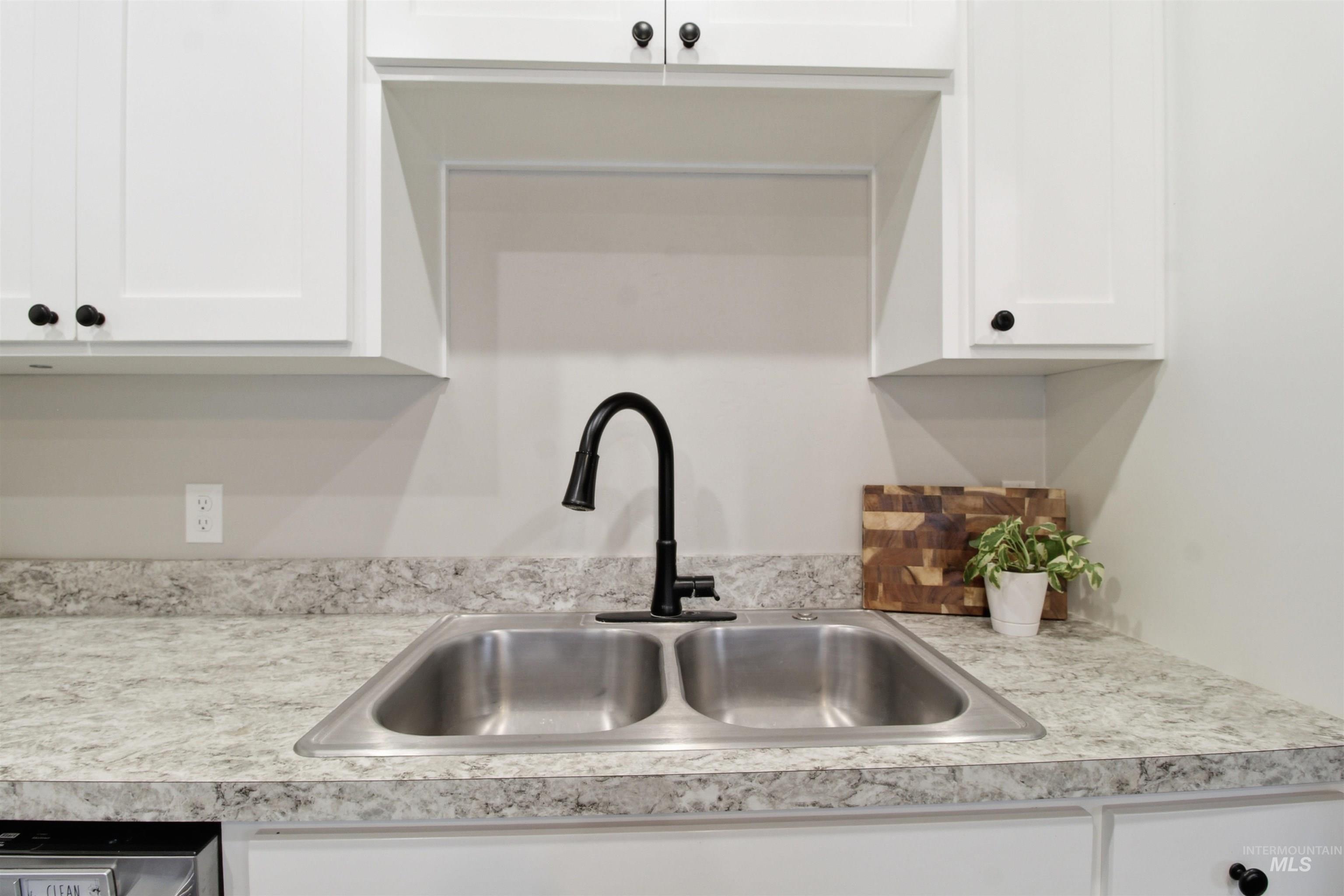 900 East 20th Street Burley, ID 83318 - Photo 9 of 31 Kitchen view of white cabinetry and light countertops