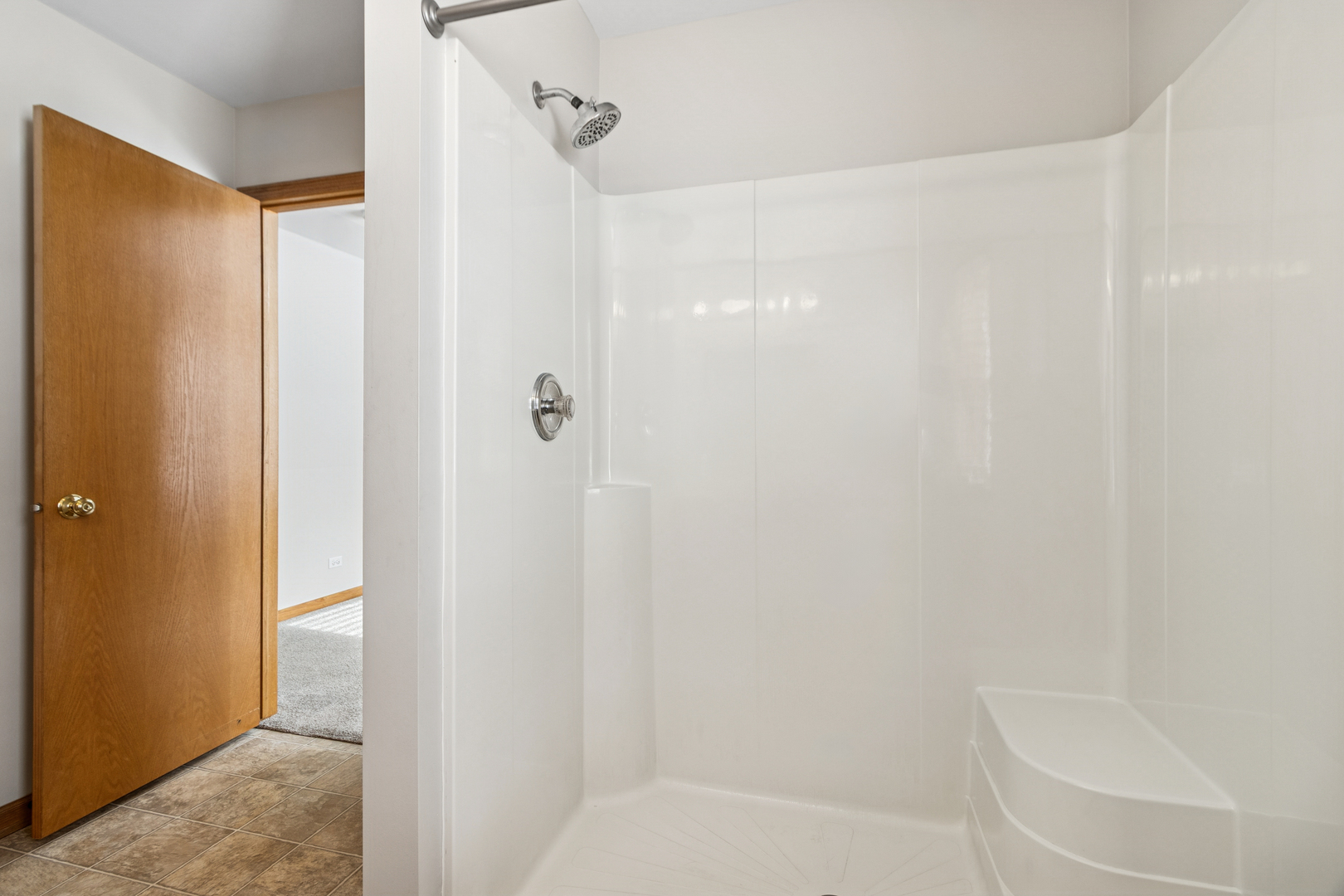 225 Morrow Street, Unit D Somonauk, IL 60552 - Photo 12 of 19 a bathroom with a shower