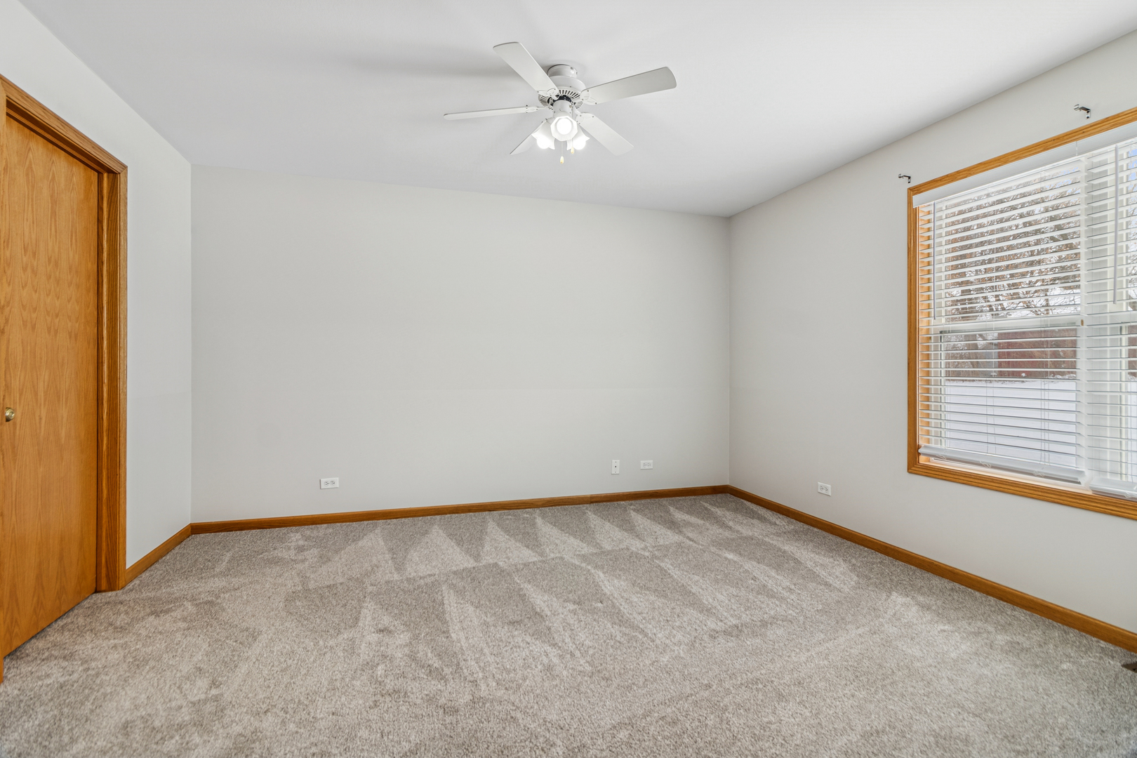 225 Morrow Street, Unit D Somonauk, IL 60552 - Photo 13 of 19 a view of an empty room with a window