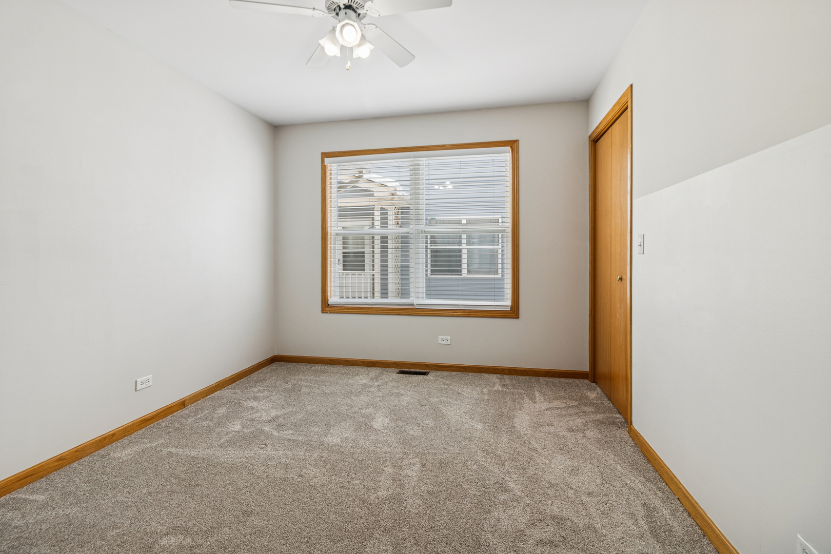 225 Morrow Street, Unit D Somonauk, IL 60552 - Photo 15 of 19 an empty room with windows