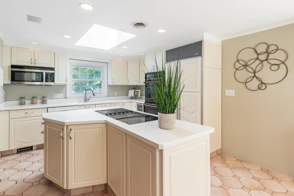 44 Philip Road Lexington, MA 02421 - Photo 12 of 31 a kitchen with a stove a sink and a refrigerator