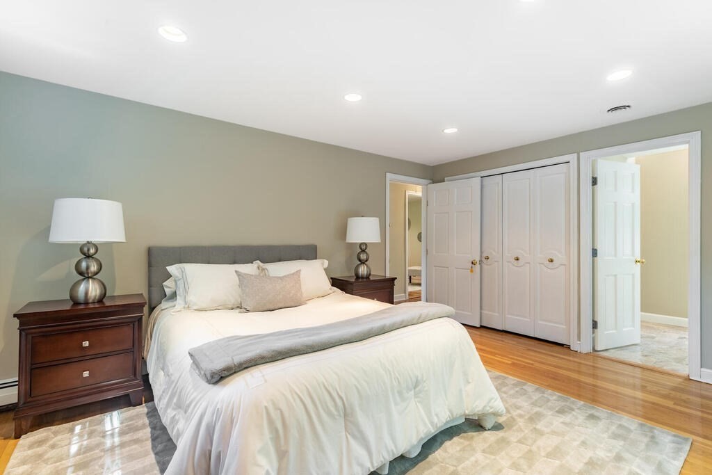 44 Philip Road Lexington, MA 02421 - Photo 15 of 31 a bedroom with a bed and a lamp