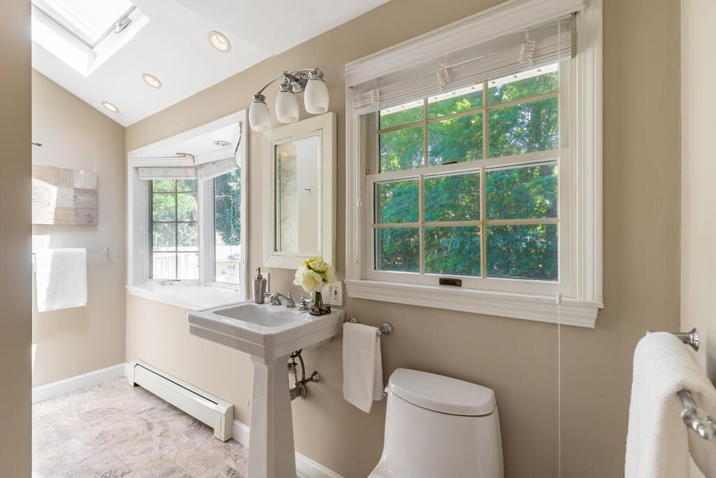 44 Philip Road Lexington, MA 02421 - Photo 17 of 31 a bathroom with a sink toilet and a mirror