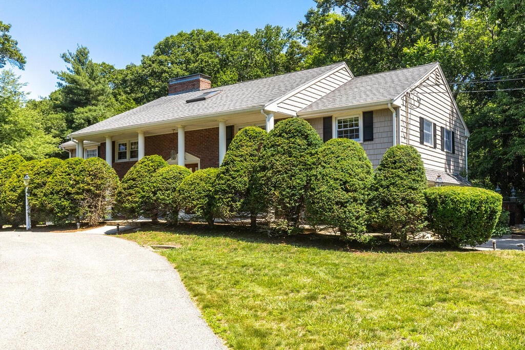 44 Philip Road Lexington, MA 02421 - Photo 2 of 31 a front view of a house with a yard