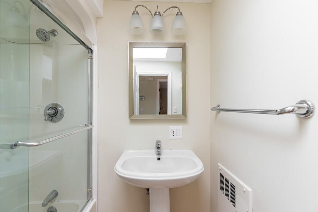 44 Philip Road Lexington, MA 02421 - Photo 21 of 31 a bathroom with a sink and mirror