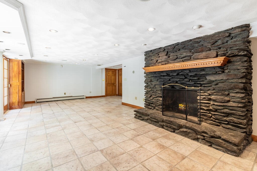 44 Philip Road Lexington, MA 02421 - Photo 23 of 31 a view of empty room with fireplace