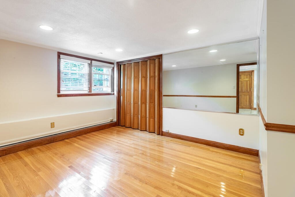 44 Philip Road Lexington, MA 02421 - Photo 25 of 31 a view of an empty room with a window