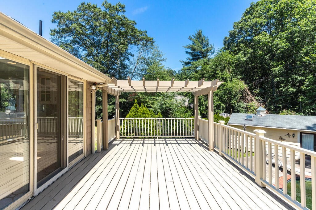 44 Philip Road Lexington, MA 02421 - Photo 28 of 31 a view of a balcony with wooden floor and fence