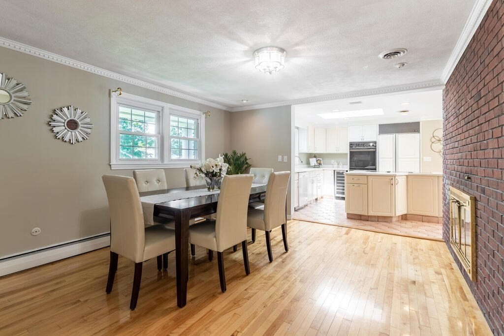 44 Philip Road Lexington, MA 02421 - Photo 8 of 31 a view of a dining room with furniture and wooden floor