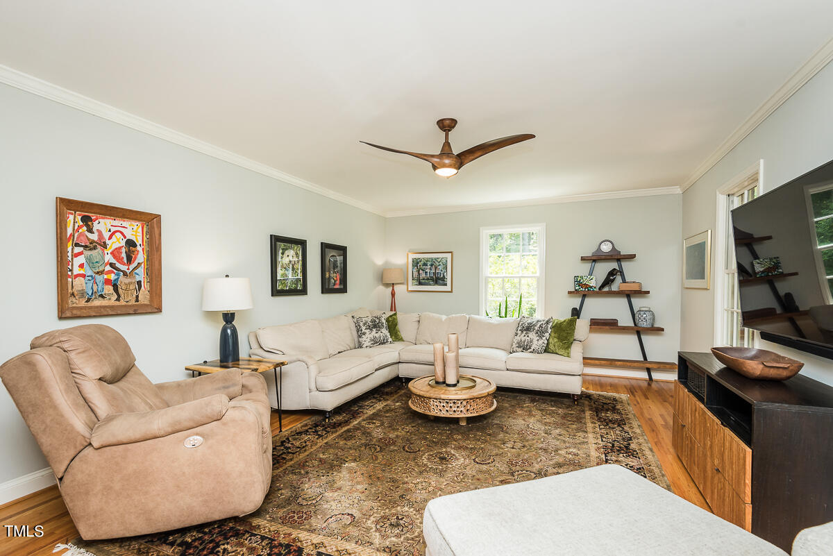 7214 Sunrise Road Chapel Hill, NC 27514 - Photo 12 of 61 a living room with furniture and a flat screen tv