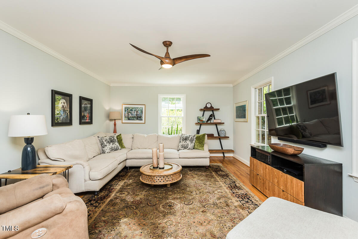 7214 Sunrise Road Chapel Hill, NC 27514 - Photo 13 of 61 a living room with furniture and a flat screen tv