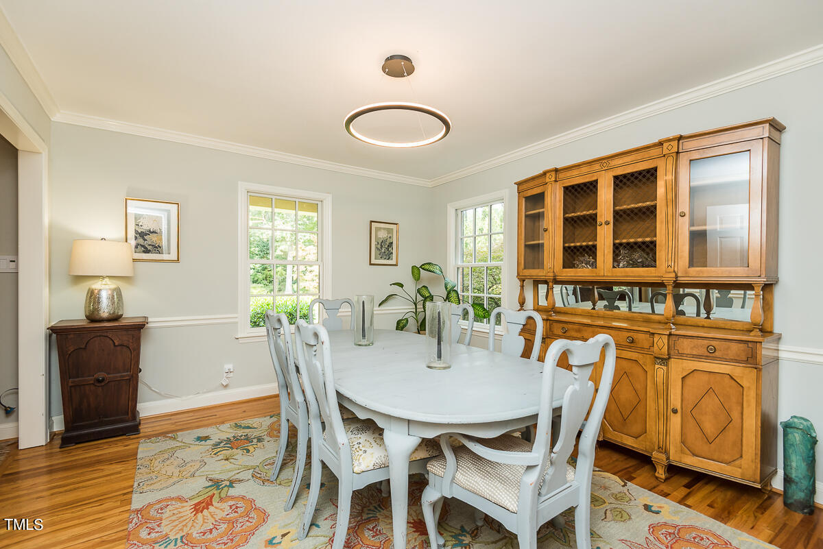 7214 Sunrise Road Chapel Hill, NC 27514 - Photo 16 of 61 a dining room with furniture and window