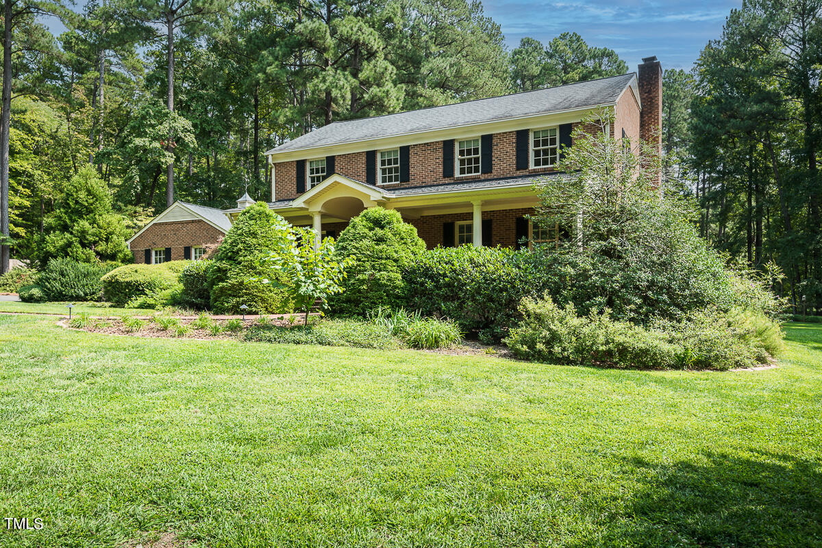 7214 Sunrise Road Chapel Hill, NC 27514 - Photo 2 of 61 a front view of a house with a yard