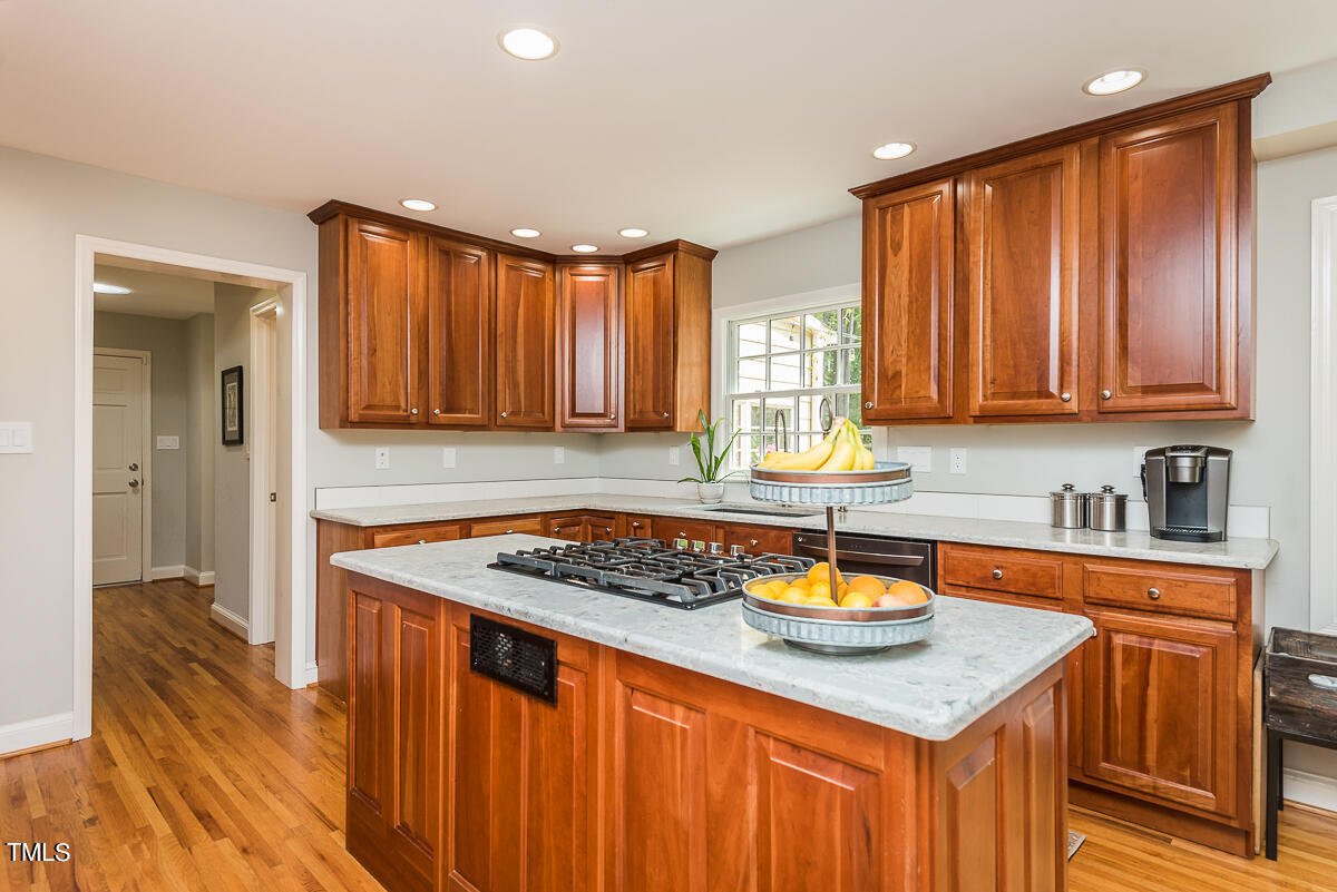 7214 Sunrise Road Chapel Hill, NC 27514 - Photo 22 of 61 a kitchen with stainless steel appliances granite countertop a sink stove and cabinets