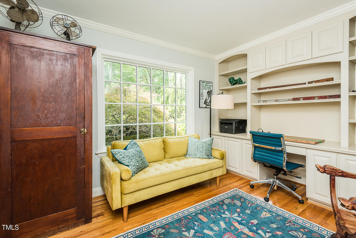 7214 Sunrise Road Chapel Hill, NC 27514 - Photo 27 of 61 a living room with furniture and a fireplace