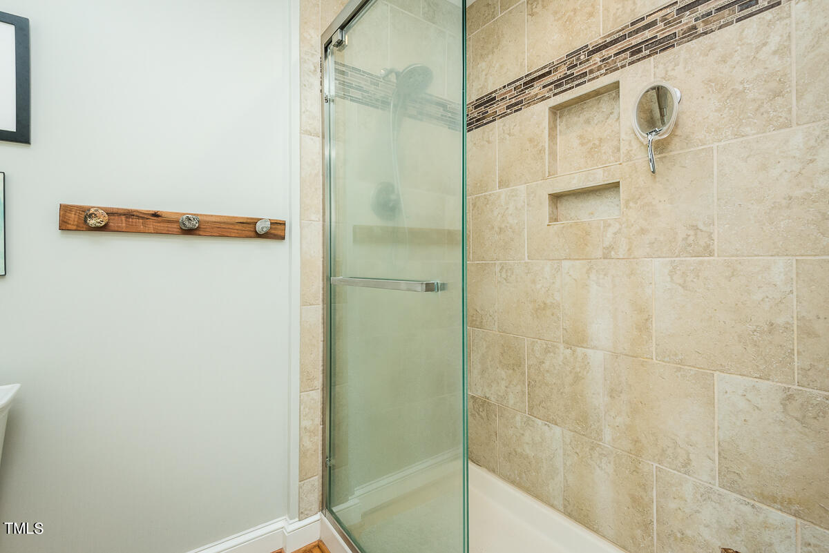 7214 Sunrise Road Chapel Hill, NC 27514 - Photo 31 of 61 a bathroom with a shower