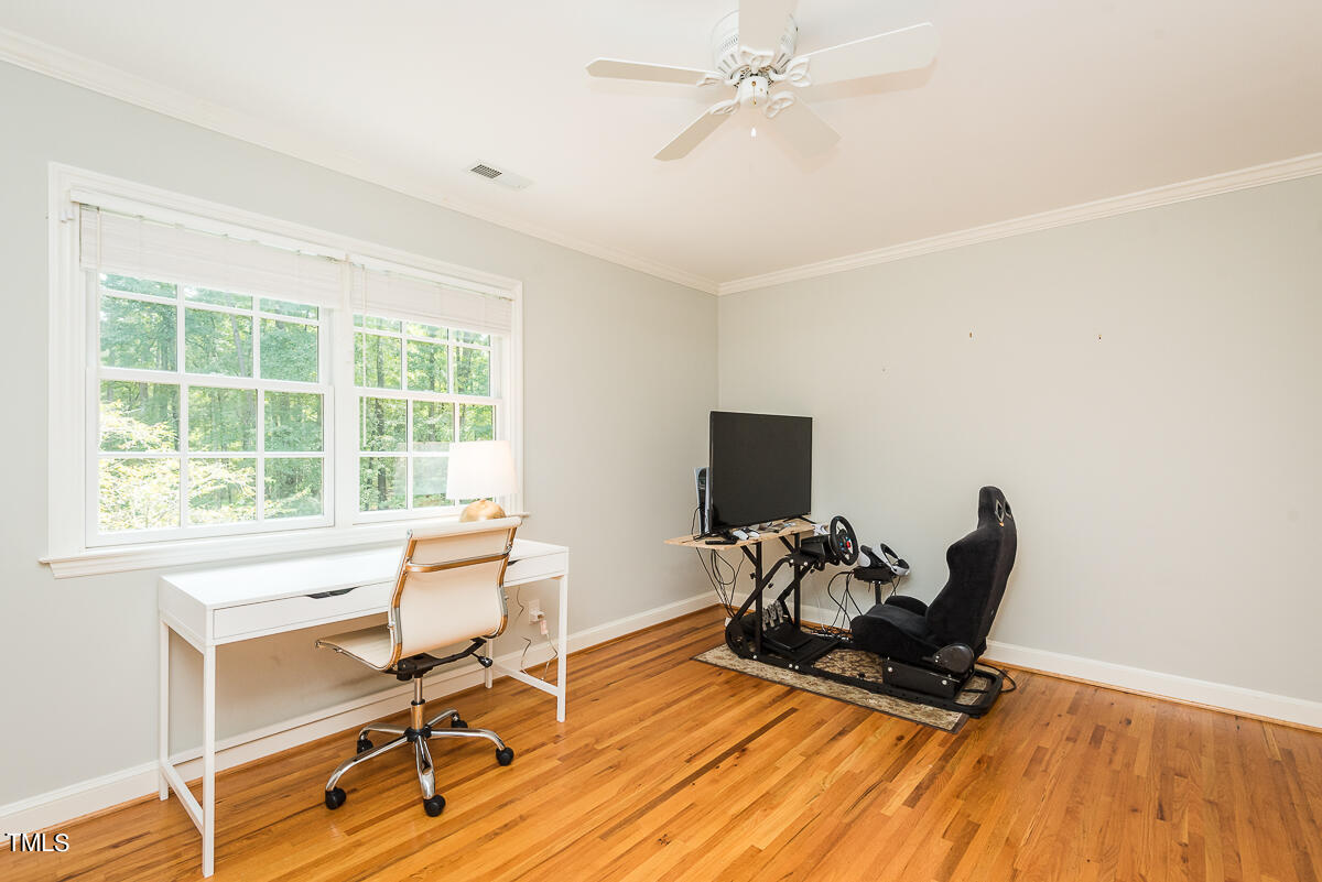 7214 Sunrise Road Chapel Hill, NC 27514 - Photo 33 of 61 a view of a workspace with furniture and a window