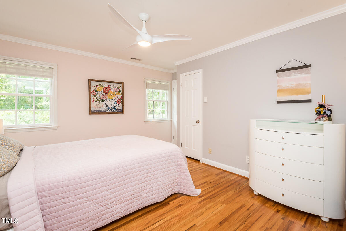 7214 Sunrise Road Chapel Hill, NC 27514 - Photo 34 of 61 a bedroom with a bed and a dresser