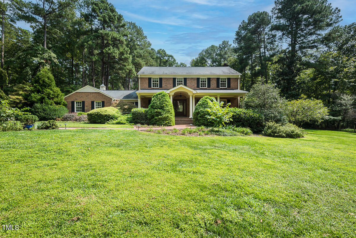 7214 Sunrise Road Chapel Hill, NC 27514 - Photo 4 of 61 a front view of house with yard and green space