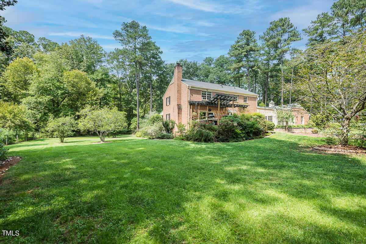 7214 Sunrise Road Chapel Hill, NC 27514 - Photo 44 of 61 a view of a house with yard and a garden