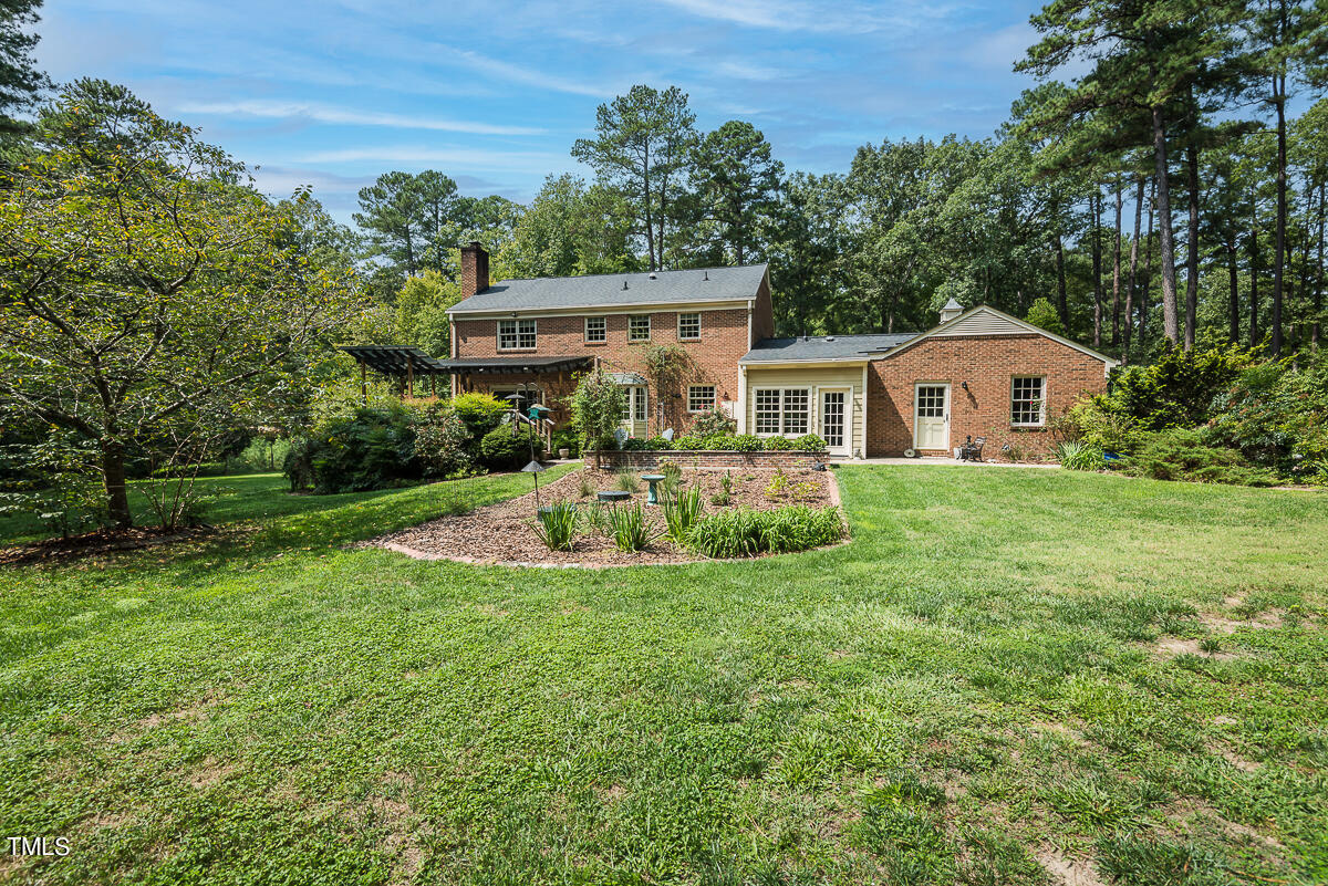 7214 Sunrise Road Chapel Hill, NC 27514 - Photo 46 of 61 a front view of house with yard and green space
