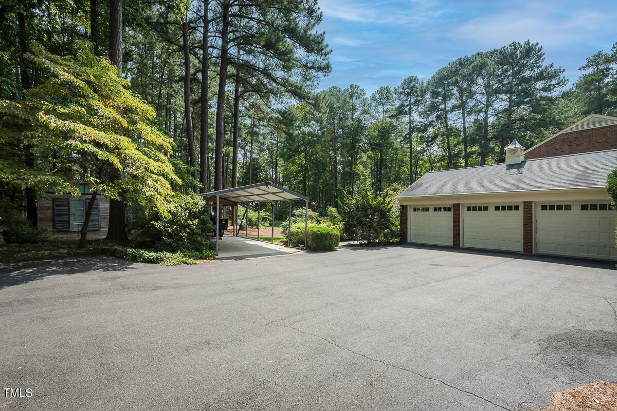 7214 Sunrise Road Chapel Hill, NC 27514 - Photo 48 of 61 a pathway of a house with a yard and tree s