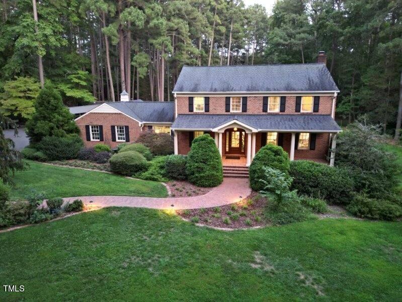 7214 Sunrise Road Chapel Hill, NC 27514 - Photo 49 of 61 a aerial view of a house next to a big yard and large trees