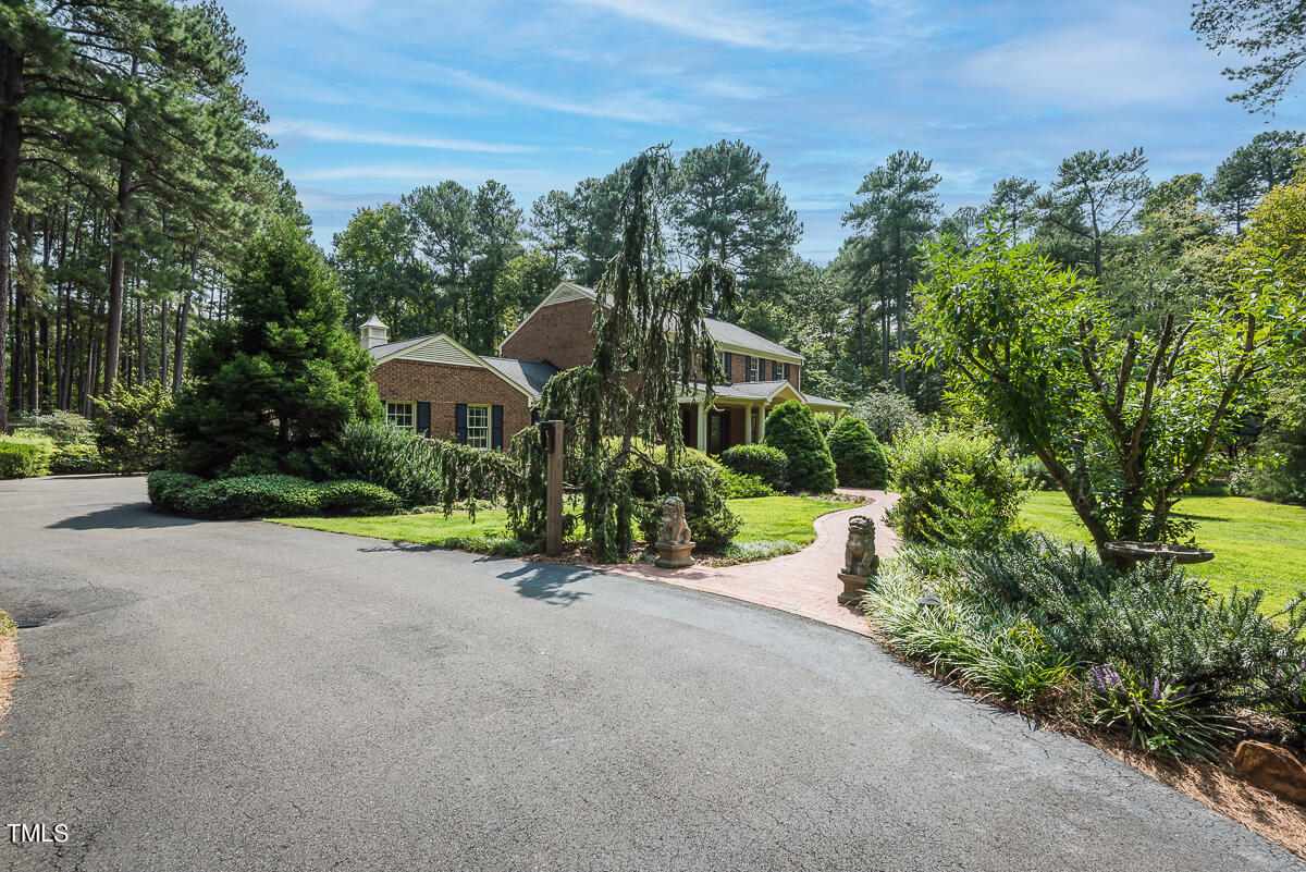 7214 Sunrise Road Chapel Hill, NC 27514 - Photo 5 of 61 a front view of a house with a yard and mountain view