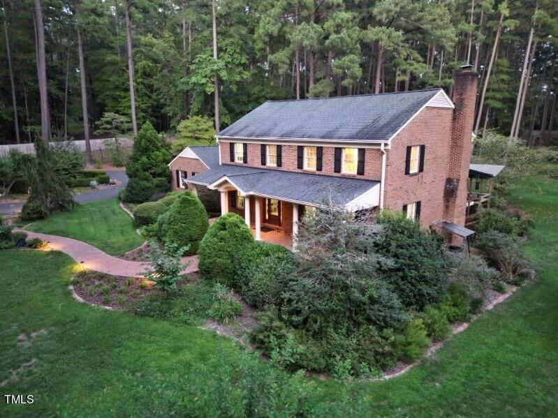7214 Sunrise Road Chapel Hill, NC 27514 - Photo 54 of 61 a aerial view of a house next to a big yard and large trees