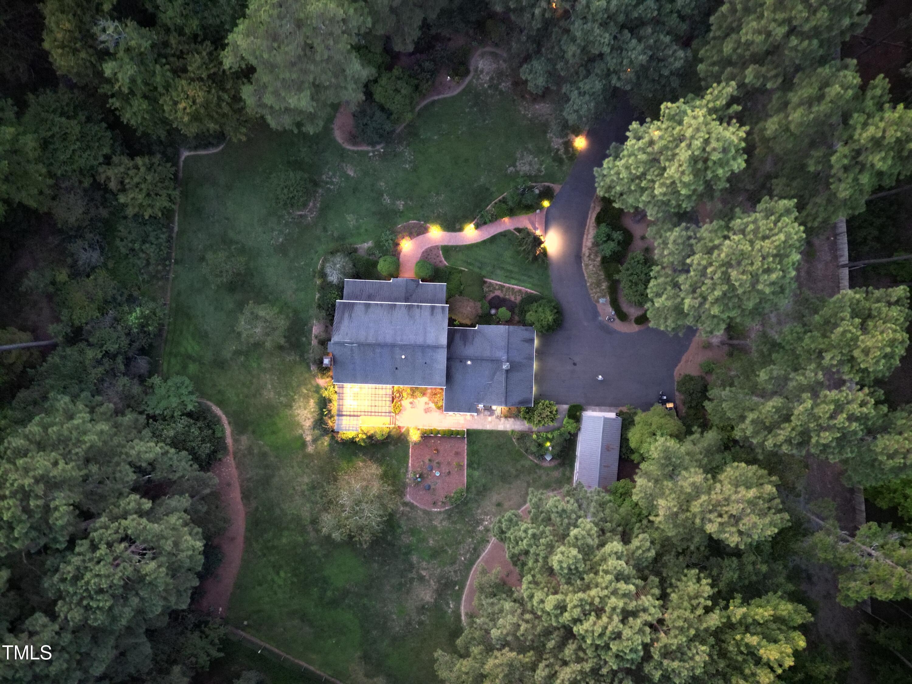 7214 Sunrise Road Chapel Hill, NC 27514 - Photo 60 of 61 an aerial view of a house with a yard