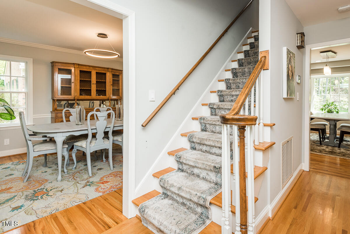 7214 Sunrise Road Chapel Hill, NC 27514 - Photo 10 of 61 a view of entryway and hall with wooden floor