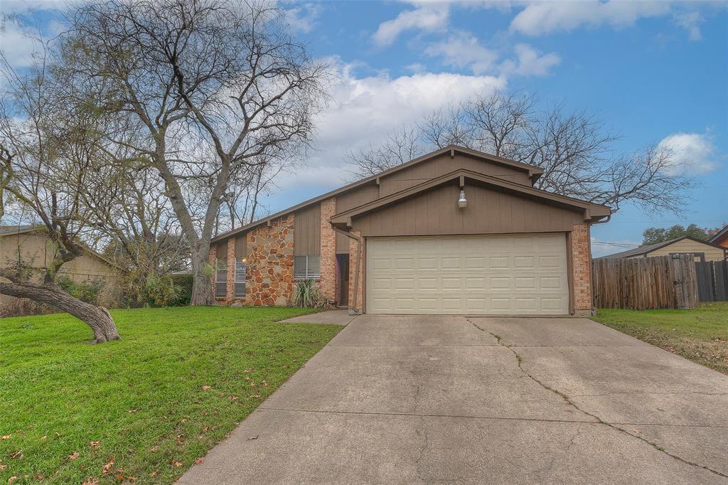 1024 Edgewood Trail Benbrook, TX 76126 - Photo 2 of 28 a front view of house with yard and trees