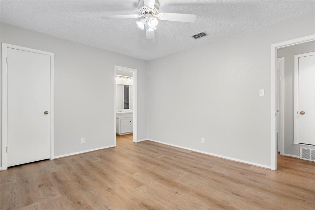 1024 Edgewood Trail Benbrook, TX 76126 - Photo 25 of 28 a view of an empty room with wooden floor